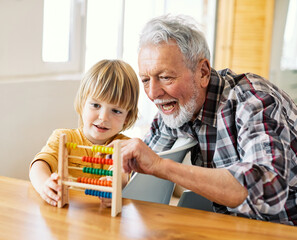 grandchild family child grandparent grandfather abacus mathematic education toy boy fun together senior finance wooden learning math count calculator tool school