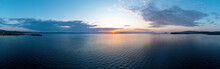 Sunrise Over Calm Ocean Aerial Panorama. Sunset Orange And Blue Color Cloudy Sky. Chalkidiki, Greece