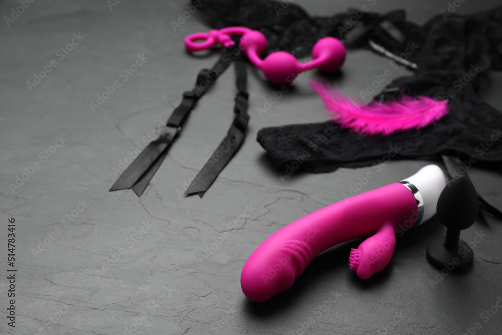 sex toys lingerie Sex toys and lingerie on black background. Space for text Stock Photo