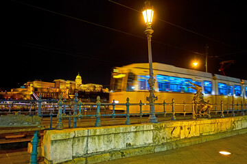 Poster - Little Princess Statue in front of riding tram, Belgrade Quay, Budapest, Hungary