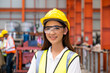 © BritCats Studio - Selective focus at young women inspector wearing safety equipment. While doing audit for quality and safety control inside of factory area. With blurred background of heavy machine.