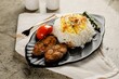 King fish with White rice and tomaato served in a dish isolated on grey background side view fast food