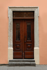 Wall Mural - View of building with vintage wooden door. Exterior design