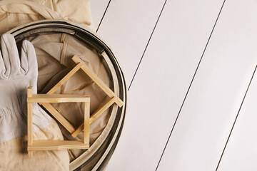 Wall Mural - Honeycomb frames and beekeeping tools on white wooden table, flat lay. Space for text