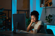 © DimaBerlin - Symptoms of overworking and fatigue. Young tired overworked African woman freelancer in eyeglasses working late from home, sitting in front of monitor, falls asleep in front of computer screen.