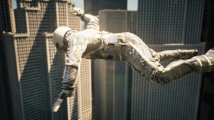 Wall Mural - astronaut traveler flying past skyscrapers. astronaut's fall from space to the planet. the flight of
