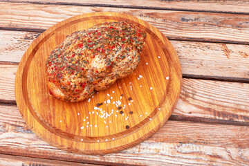 Wall Mural - Baked meat on wooden surface