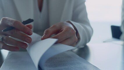 businesswoman hands checking contract closeup. lawyer reading legal documents