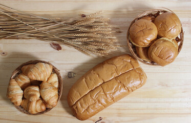 Fresh Baked Bread in Rustic Kitchen on Wooden Table Top View