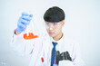 © Tanawit - Asian scientists are seriously studying the chemical composition in the laboratory. Specializing in Young Biotechnology Use advanced microscope equipment.