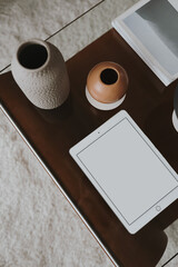 Wall Mural - Tablet pad with blank screen on decorated coffee table. Aesthetic template with mockup copy space. Online store, blog, social media, website branding. Online shopping concept