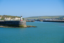 Harbour Entrance With Lighthouse Newhaven, East Sussex, England On A Summer Day