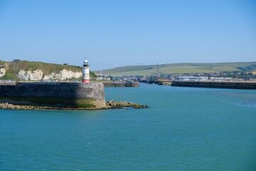 Harbour entrance with lighthouse Newhaven, East Sussex, England on a summer day