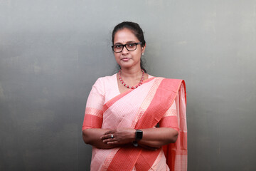 Wall Mural - Portrait of a happy woman of Indian ethnicity wearing traditional dress sari