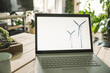 © Westend61 - Wind turbine design on screen of laptop at home office
