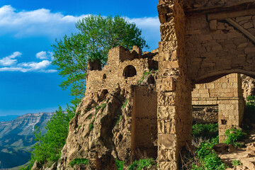 Wall Mural - ruins of walls of houses on a cliff in the abandoned village of Gamsutl