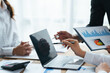 © PaeGAG - Business people working in the office discussing documents and ideas at meeting, Asian business advisor meeting to analyze and discuss the situation on the financial report.
