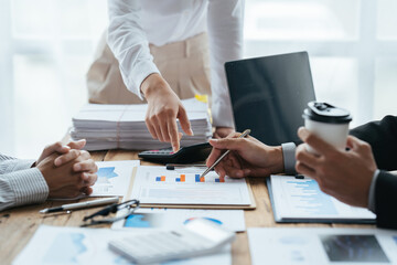 Business people working in the office discussing documents and ideas at meeting, Asian business advisor meeting to analyze and discuss the situation on the financial report.