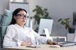 © Liubomir - Asian business woman is sick in the office, has severe stomach pain, nausea and diarrhea.