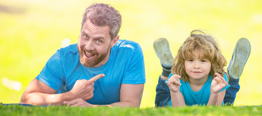 Wall Mural - Banner of father and son in summer park outdoor. dad with kid on summer day. parenting and fatherhood. fathers day.