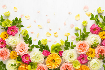 Wall Mural - Composition of beautiful flowers, succulents and leaves on light background. Flowers frame.Top view, copy space.