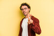 © Asier - Young caucasian man isolated on yellow background showing number two with fingers.