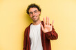 © Asier - Young caucasian man isolated on yellow background smiling cheerful showing number five with fingers.