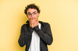 © Asier - Young caucasian man isolated on yellow background covering mouth with hands looking worried.