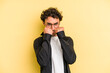 © Asier - Young caucasian man isolated on yellow background throwing a punch, anger, fighting due to an argument, boxing.