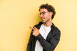 © Asier - Young caucasian man isolated on yellow background looks aside smiling, cheerful and pleasant.