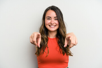 young caucasian woman isolated on white background cheerful smiles pointing to front.