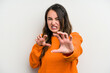 © Asier - Young caucasian woman isolated on white background showing claws imitating a cat, aggressive gesture.