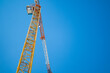 Tower Crane on Blue Sky Background