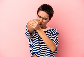 Wall Mural - Young caucasian woman isolated on blue background having a neck pain due to stress, massaging and touching it with hand.