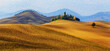 Beautiful rural landscape with hills, arable land and cypresses, autumn hills.
