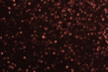 Wall Mural - Abstract background of multi-layered brown bokeh on a dark background. Lots of small brown glowing defocused circles. Can be used as a backdrop or overlay for your creatives as well as app backgrounds