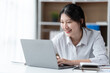 © PaeGAG - Asian woman working with laptop in her office. business financial concept.