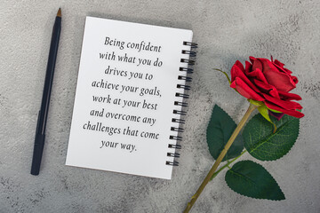 Wall Mural - Motivational quote on note book with red roses and a pen.