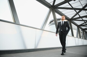 Portrait of an handsome businessman in an urban setting