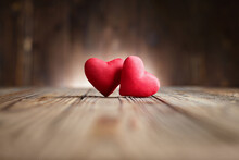 Two Red Hearts On Dark Wooden Background