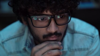 Wall Mural - indian crypto trader analyst wearing eyeglasses working looking at computer screen reflecting in gla