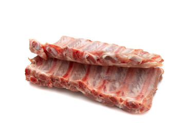 Two pieces of raw pork ribs. Isolated on white background. Highly demanded meat for barbecues.