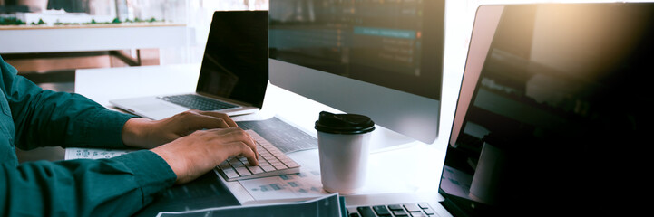 Wall Mural - asian man working code program developer computer web development working design software on desk in
