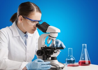 Sticker - Students working in the clinical laboratory, a researcher is using a microscope, scientific research concept