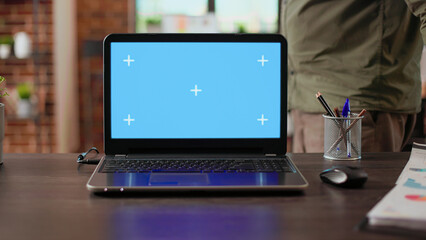 Wall Mural - nobody at desk with laptop computer on greenscreen template, isolated chroma key display and blank c
