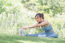 Young Sportswoman Stretching And Preparing To Run In Park, Fitness Woman Stretching Muscles Before Sport Activity