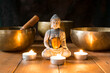 © selugallego - Still life with Tibetan singing bowls, minerals, candles and a Buddha figure.
