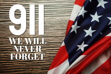 911 We Will Never Forget  Word With USA Flag On Wooden Background