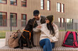 © NFstock - Happy spouses is enjoying time together with their dog. Woman stroking and embracing cute Labrador doggy while sitting at the bench during the walking. Youth lifestyle concept