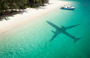 Beautiful tropical beach with airplane shadow